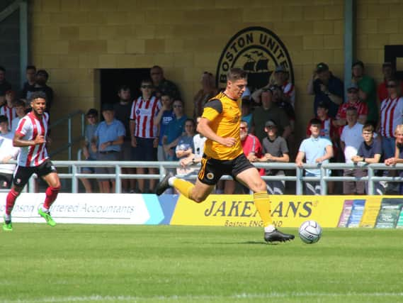 Scott Duxbury in action against Lincoln City. Photo: Oliver Atkin