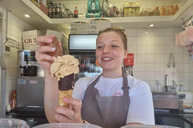 Amelia Fravigar putting the finishing touches to a salted caramel ice-cream at Seaside Treats in Tower Esplanade, Skegness.