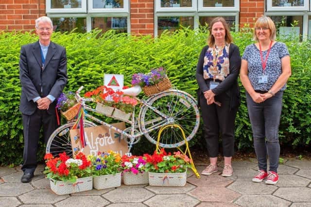 Richard Quantrell, Mayor of Alford with staff at Alford Primary School and one of the school's decorated bikes.
