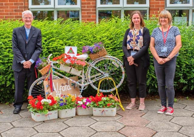 Richard Quantrell, Mayor of Alford with staff at Alford Primary School and one of the school's decorated bikes.