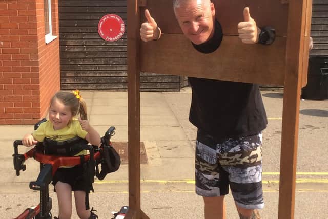 Reiko with assistant caretaker Sean Barker in the stocks.