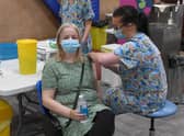 Lisa Szirtes of Sleaford receiving the 1 millionth vaccination in Lincolnshire, at PRSA vaccination centre. The vaccinator is Sam Prichard EMN-210723-142549001
