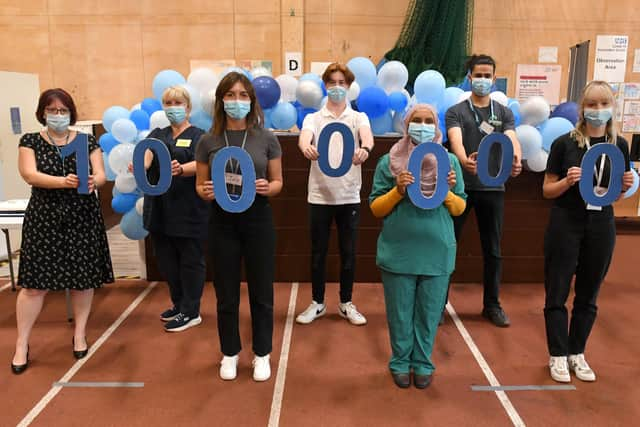 Marking the vaccination milestone in Lincolnshire. From left - Rebecca Neno, Lynda Stockwell, Joanne Dennis, Nathan Dunford, Dr Amira Ibrahim, Ula Boney-Hundal and Abbie Roberts. EMN-210723-142536001