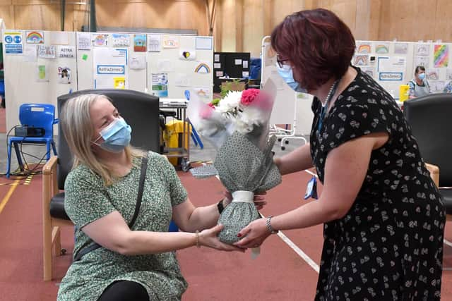 Lisa Szirtes of Sleaford receiving flowers from Rebecca Neno. EMN-210723-142624001