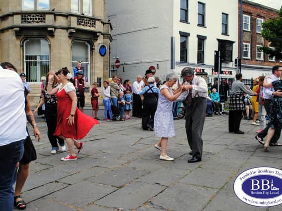 Dancing in the street at a 40s event in the past