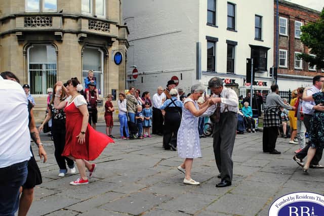 Dancing in the street at a 40s event in the past