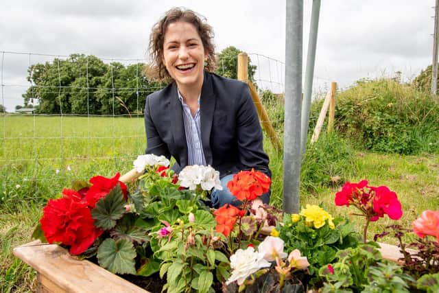 MP Victoria Atkins pictured with one of the planters.