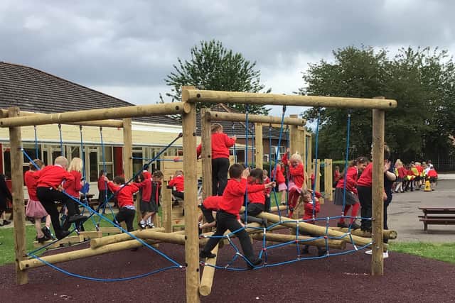 Ruskington Chestnut Street School children enjoying the new trim trail and multi-use games area. EMN-210728-164605001