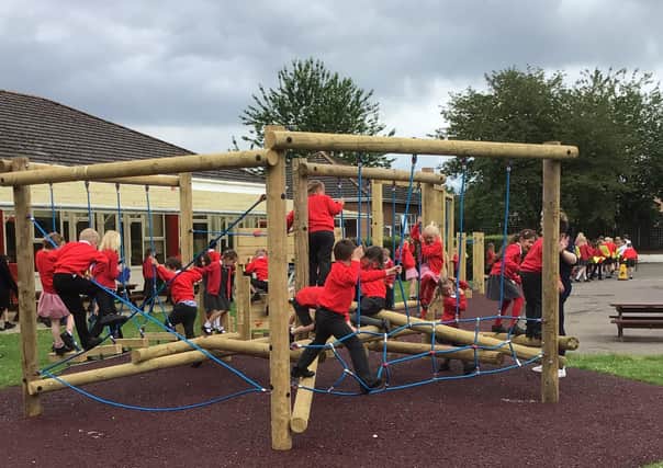 Ruskington Chestnut Street School children enjoying the new trim trail and multi-use games area. EMN-210728-164605001