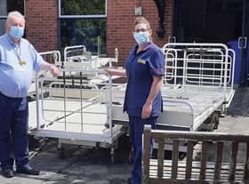 Twenty redundant beds destined for scrap were donated to the Jacob's Well Appeal in Beverley recently. They will use them to furnish a newly-built hospital in Ghana. Pictured is Goole Matron, Kerry Owen, and Grahame Williams, Logistics and Waste Officer, with the beds prior to loading.
