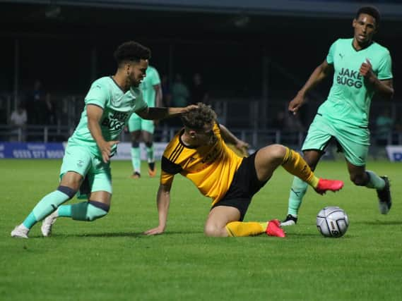 Wright jnr battles for the ball against Notts. Photo: Oliver Atkin