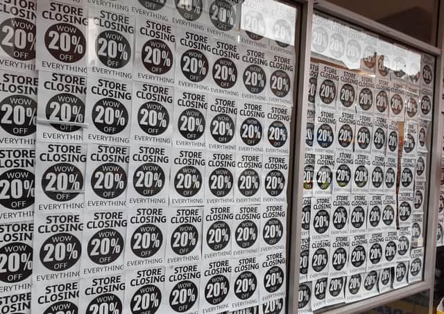Closing down signs in the window of Poundstretcher, in Strait Bargate, Boston.
