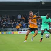 Luke Shiels battles against Notts County. Photo: Oliver Atkin