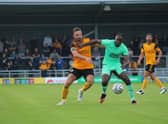 Luke Shiels battles against Notts County. Photo: Oliver Atkin