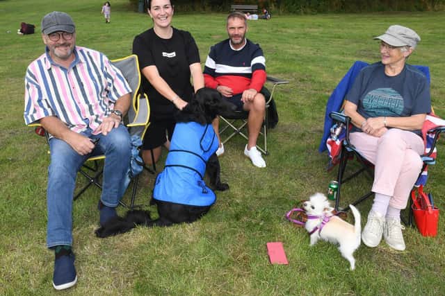 Enjoying the live music are (from left) Mark Lawson, Sam Billson, Lee Billson, Sue Lawson. Dogs Nell and Moose.