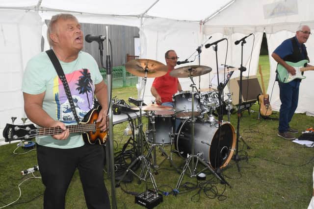Rocking on Tinkers Green are local band, Hat Trick.