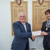 Deputy Mayor Coun Billy Brookes presents a cheque for £450 to Skegness Rotary Club member Coun Tony Tye.