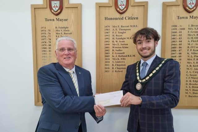 Deputy Mayor Coun Billy Brookes presents a cheque for £450 to Skegness Rotary Club member Coun Tony Tye.