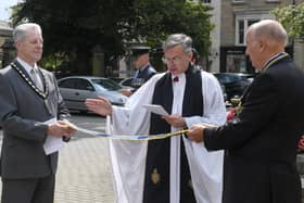 Rev Philip Johnson blessing the pennant that was awarded to the Sleaford and District branch of RBL, marking the 100 year anniversary. EMN-210908-091717001