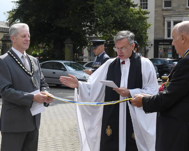 Rev Philip Johnson blessing the pennant that was awarded to the Sleaford and District branch of RBL, marking the 100 year anniversary. EMN-210908-091717001