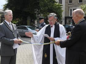 Rev Philip Johnson blessing the pennant that was awarded to the Sleaford and District branch of RBL, marking the 100 year anniversary. EMN-210908-091717001