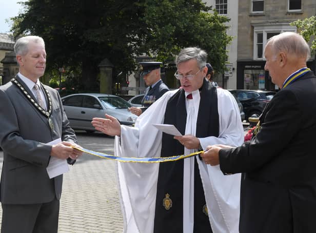 Rev Philip Johnson blessing the pennant that was awarded to the Sleaford and District branch of RBL, marking the 100 year anniversary. EMN-210908-091717001