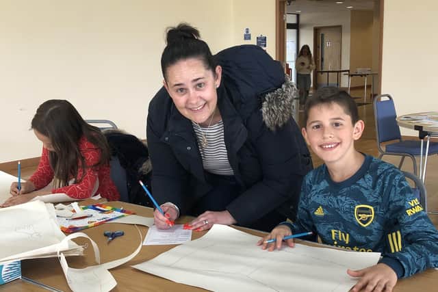 Families enjoy flag making activities at Navenby. EMN-210908-165400001