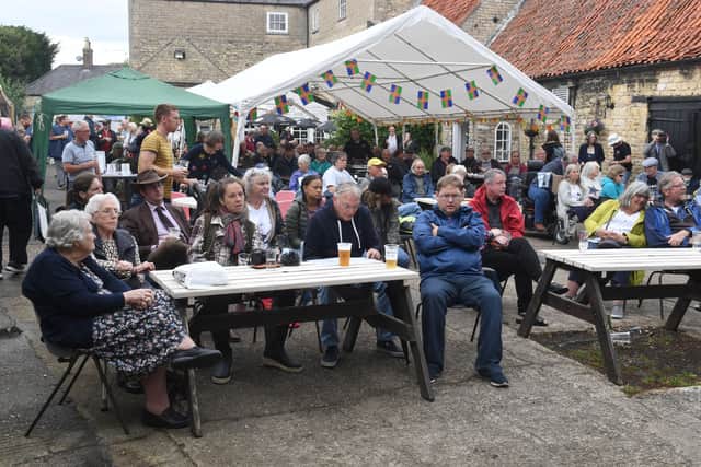 Enjoying the live music at the Courtyard Stage. EMN-210908-093740001