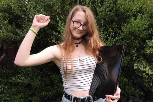 Checking her grades online. Kesteven and Sleaford High School student Lucy Hubbert was one of the success stories, gaining three A* grades at A-level. She will now head to Loughborough University to study graphic design. EMN-211008-111752001