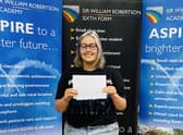 Asher Williams of Caythorpe getting her A-level results at Sir William Robertson Academy. EMN-211008-122654001