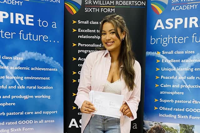 Evie Pearson of Caythorpe getting her A-level results at Sir William Robertson Academy. EMN-211008-122717001