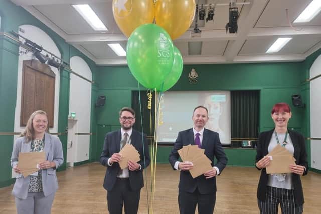 Ready to hand out the results are Headteacher Jude Hunton (second right) with (from left) Assistant Head Emma Bennett, Assistant Head and Head of Sixth Form Tom Wardell and Vice Principal Lorraine Walker.