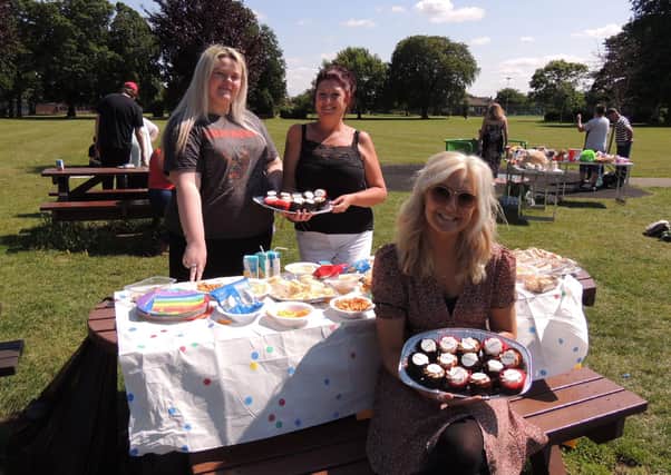 Serving up a good spread for charity at the family picnic on Boston Road park. From left - Rebecca Smith - bureau analyst for Utility Aid, Jane Peck of Rainbow Stars and Sasha Oliver - customer care and communications manager for Utility Aid. EMN-210813-112334001
