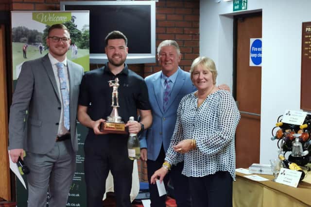 Cal Ellman collects his trophy from Barry, Rachel and Will Jones.