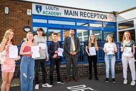 Students celebrate with principal Philip Dickinson. All pictures: Jon Corken