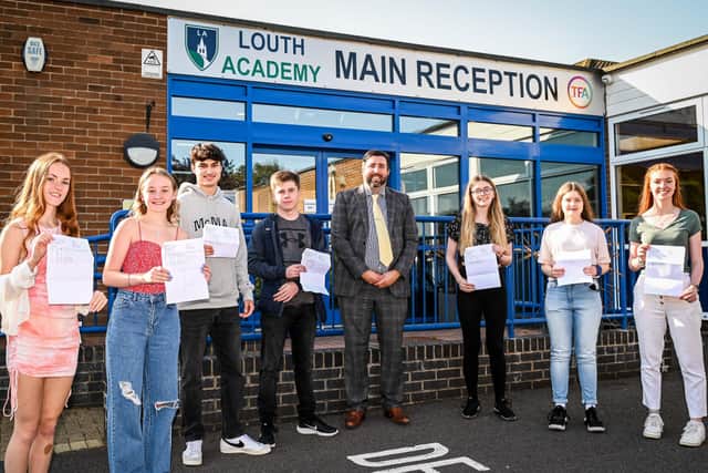 Students celebrate with principal Philip Dickinson. All pictures: Jon Corken