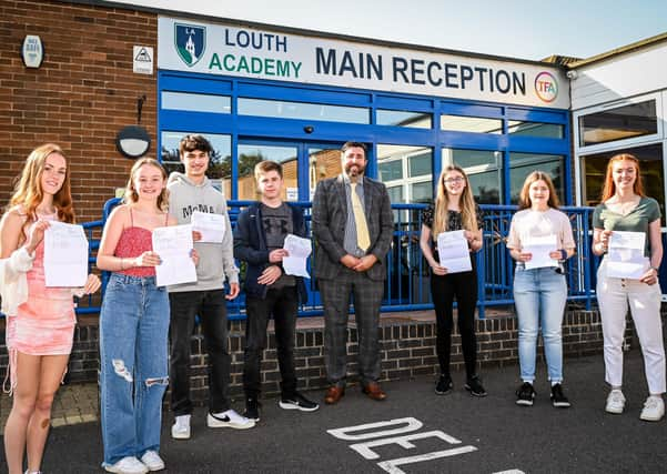 Students celebrate with principal Philip Dickinson. All pictures: Jon Corken