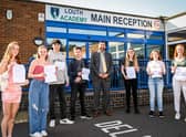 Students celebrate with principal Philip Dickinson. All pictures: Jon Corken