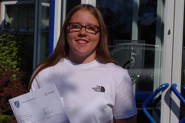Charlotte Wright with her GCSE results. EMN-211208-134214001