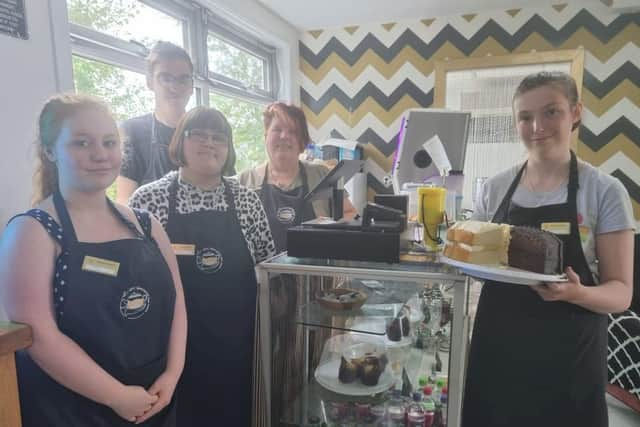 Carole Goulding (second right) with students and volunteer Lilly Calladine (left) at the tearooms.