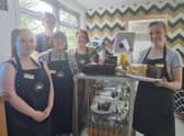 Carole Goulding (second right) with students and volunteer Lilly Calladine (left) at the tearooms.