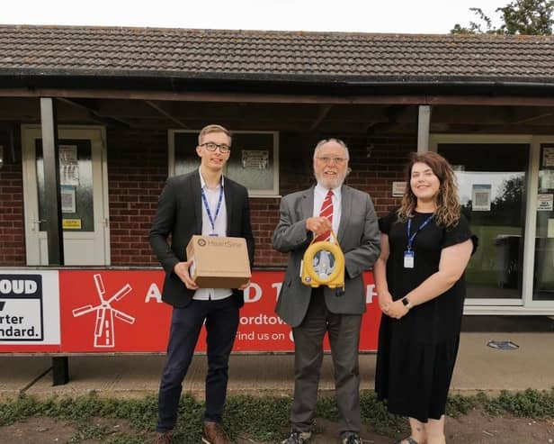 Connor Storr and Teri Beardsley of Safelincs are pictured with Alford Town secretary Rob Wilson.