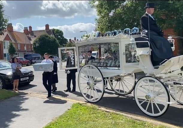 Baby Archie arrives at St Matthew's Church in his  tiny Dumbo-themed coffin.