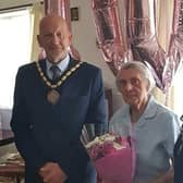 Mary Clay (centre) had a surprise visit from Mayor of Skegness Coun Trevor Burnham for her 100th birthday.