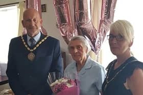 Mary Clay (centre) had a surprise visit from Mayor of Skegness Coun Trevor Burnham for her 100th birthday.