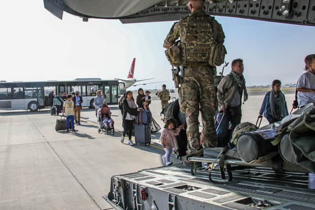 FACES BLURRED AT SOURCE Ministry of Defence undated handout photo of British citizens and dual nationals residing in Afghanistan getting on a RAF plane before being relocated to the UK. British troops are racing against the clock to get remaining UK nationals and their local allies out of Afghanistan following the dramatic fall of the country's Western-backed government to the Taliban. Issue date: Tuesday August 17, 2021.