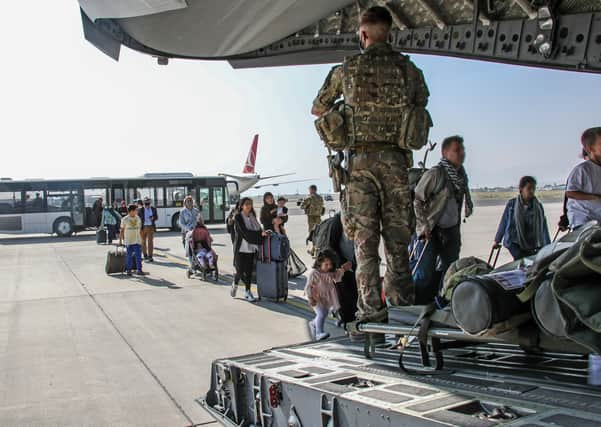 FACES BLURRED AT SOURCE Ministry of Defence undated handout photo of British citizens and dual nationals residing in Afghanistan getting on a RAF plane before being relocated to the UK. British troops are racing against the clock to get remaining UK nationals and their local allies out of Afghanistan following the dramatic fall of the country's Western-backed government to the Taliban. Issue date: Tuesday August 17, 2021.