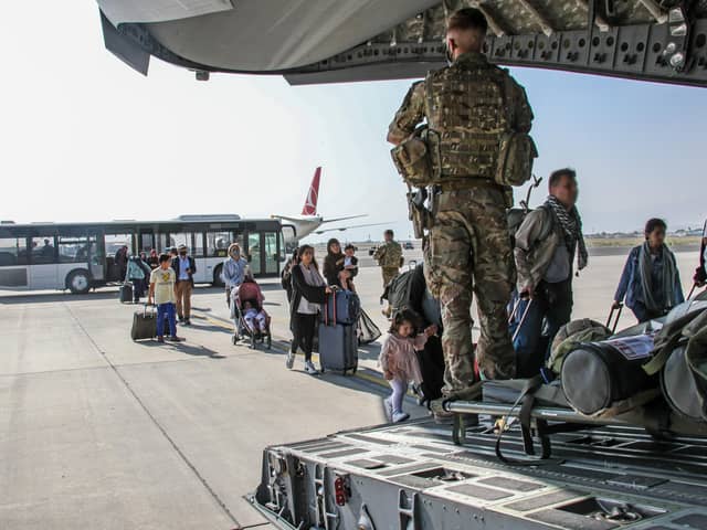 FACES BLURRED AT SOURCE Ministry of Defence undated handout photo of British citizens and dual nationals residing in Afghanistan getting on a RAF plane before being relocated to the UK. British troops are racing against the clock to get remaining UK nationals and their local allies out of Afghanistan following the dramatic fall of the country's Western-backed government to the Taliban. Issue date: Tuesday August 17, 2021.