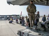 FACES BLURRED AT SOURCE Ministry of Defence undated handout photo of British citizens and dual nationals residing in Afghanistan getting on a RAF plane before being relocated to the UK. British troops are racing against the clock to get remaining UK nationals and their local allies out of Afghanistan following the dramatic fall of the country's Western-backed government to the Taliban. Issue date: Tuesday August 17, 2021.