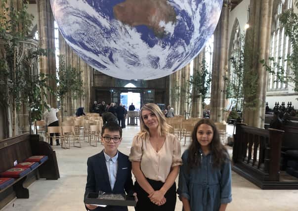 William Alvey School pupil sDavid and Ithar with Year 6 teacher Natalie Mason at Hull Minster for the centenary service. EMN-210823-175650001